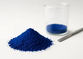 Red-shade blue pigment particles (alpha copper phthalocyanine) under stylized microscopy with dispersion and temperature icons